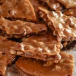 Delicious broken pieces of buttery peanut brittle.